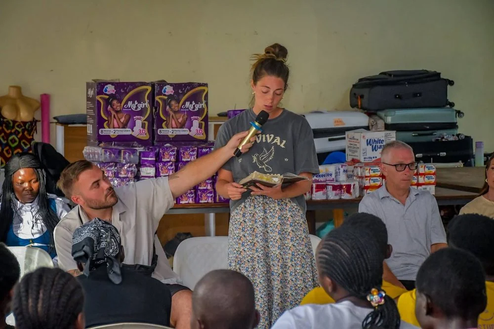 A scripture reading during a gathering with Manna Ministries